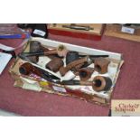 A box of various clay and other pipes