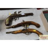 Three ornamental pistols