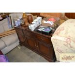 A reproduction modern sideboard with three drawers