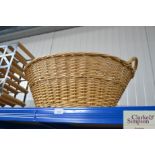 A wicker linen basket/ log basket