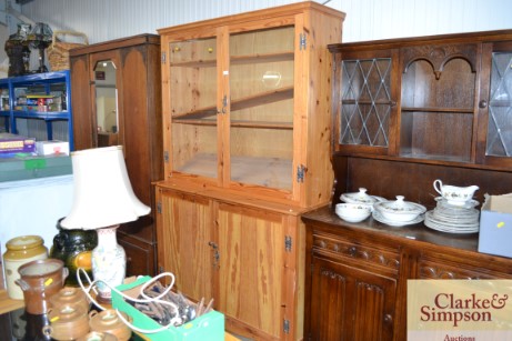 A pine kitchen dresser with glazed doors to top