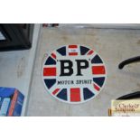 A circular BP Motor Spirit cast iron sign