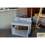 A grey painted dressing chest