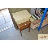 A small wicker basket and a small oak sewing box