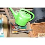 Two watering cans and a box of various garden tool