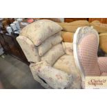 An electric rise and recliner easy chair