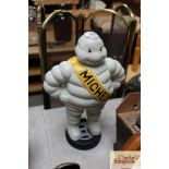 A reproduction Michelin man standing on tyre