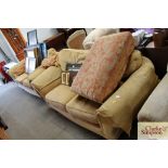 A pair of two seater settees and pouffe