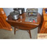 An oak drop leaf table