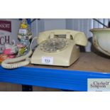 A cream vintage style telephone