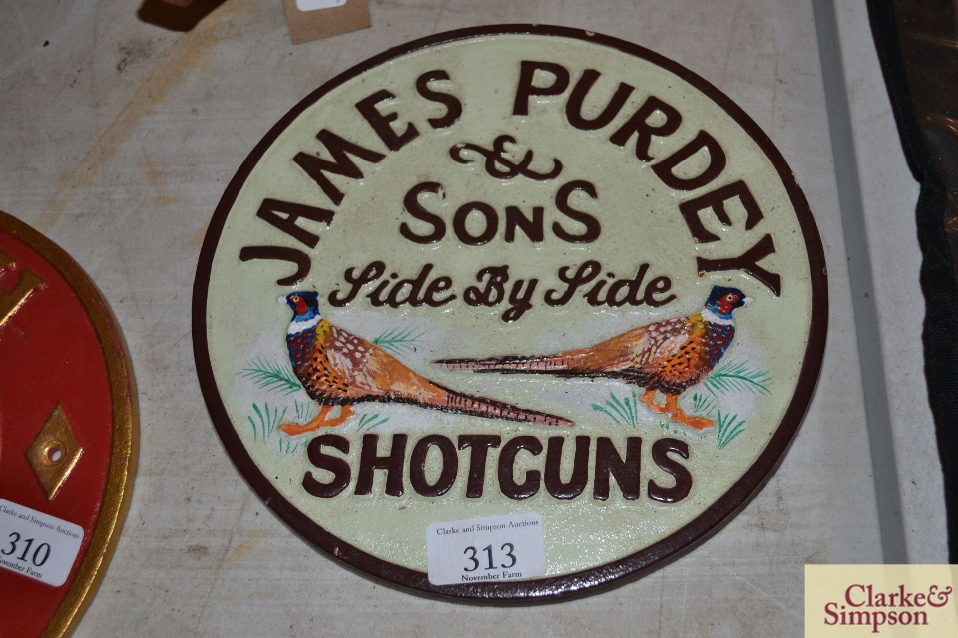 Purdy reproduction cast iron sign.