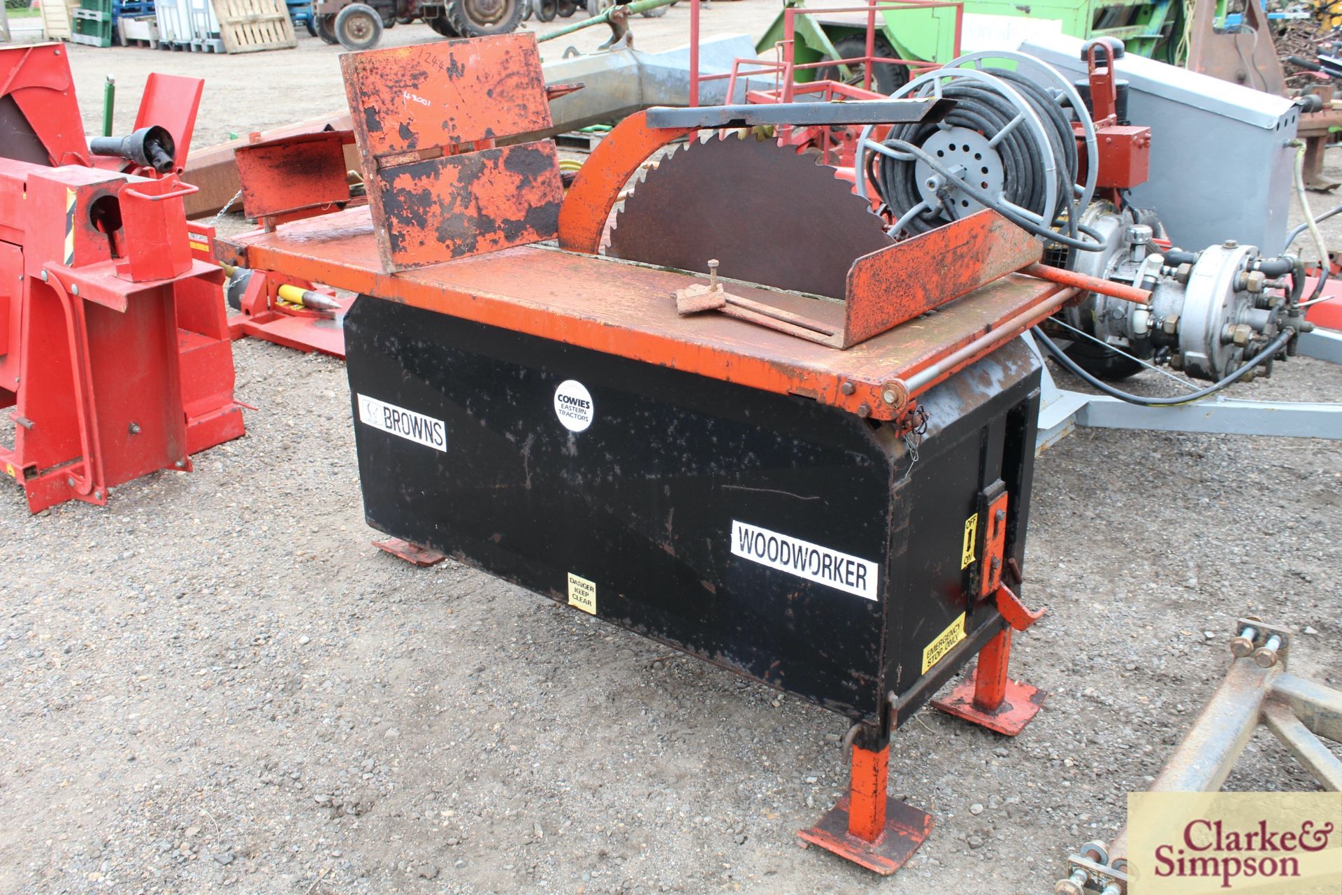 Browns Woodworker sliding table PTO saw bench. With attachments.