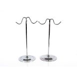 A pair of chrome adjustable shop display stands, 4