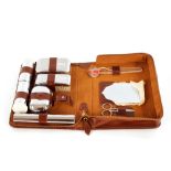 A gentleman's cased travelling toilet set; and fou