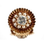 A brooch set with an old European cut diamond, approx. 2 carat, surrounded by seed pearls in 9ct gol