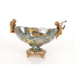 A porcelain and bronze mounted comport with cherub