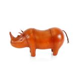 A tan leather Rhinoceros stool, 58cm long overall