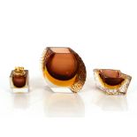 A three piece amber and smoked Art Glass lighter,