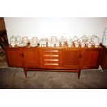 A teak G-plan sideboard, fitted four central drawe