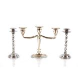 A chrome three branch candelabra; and a pair of ch