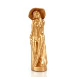 A bronze finish glass figure of a naked girl with
