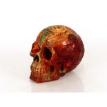 A decorative amber skull ornament