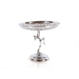 A chromed fruit bowl, with naked dancing girl colu