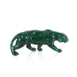 A green glazed pottery lioness figure, 47cm long