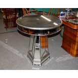 A decorative mirrored circular occasional table, o