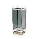 A glass and metal umbrella stand