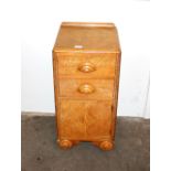 An Art Deco oak bedside cabinet, fitted two drawer