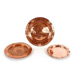 Three copper Arts & Crafts chargers, one by Lombar