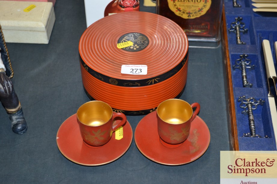 A circular lacquered box and cover and two lacquer