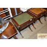 A reproduction mahogany drop leaf side table with