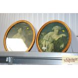 A pair of gilt framed oval portrait prints