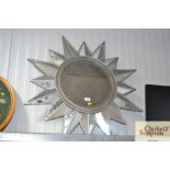 A sunburst wall mirror