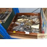 A box of various cutlery