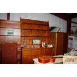 A large stripped pine kitchen dresser