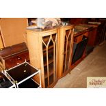 A walnut bow fronted display cabinet