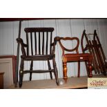 A Victorian slat back elm seated elbow chair; and