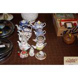 A collection of miniature porcelain teapots etc.