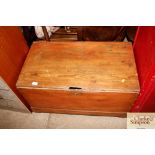 An antique stripped pine trunk