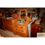 An Edwardian satin walnut dressing chest