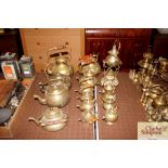 A collection of various brass kettles etc.