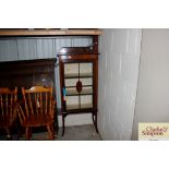 An Edwardian inlaid mahogany china display cabinet