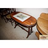 A Victorian oval mahogany stretcher table