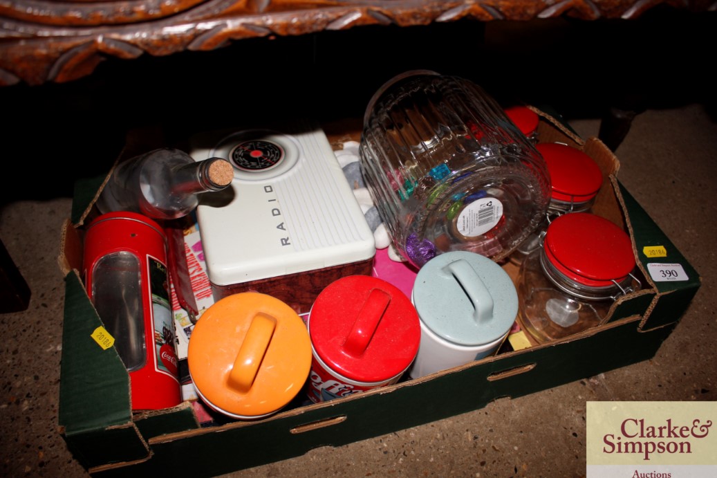 A box containing various vintage kitchen storage j
