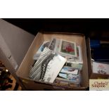 A box of miscellaneous postcards