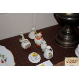 A crested china hat and various crested china jugs