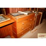 An antique stripped pine chest fitted four drawers